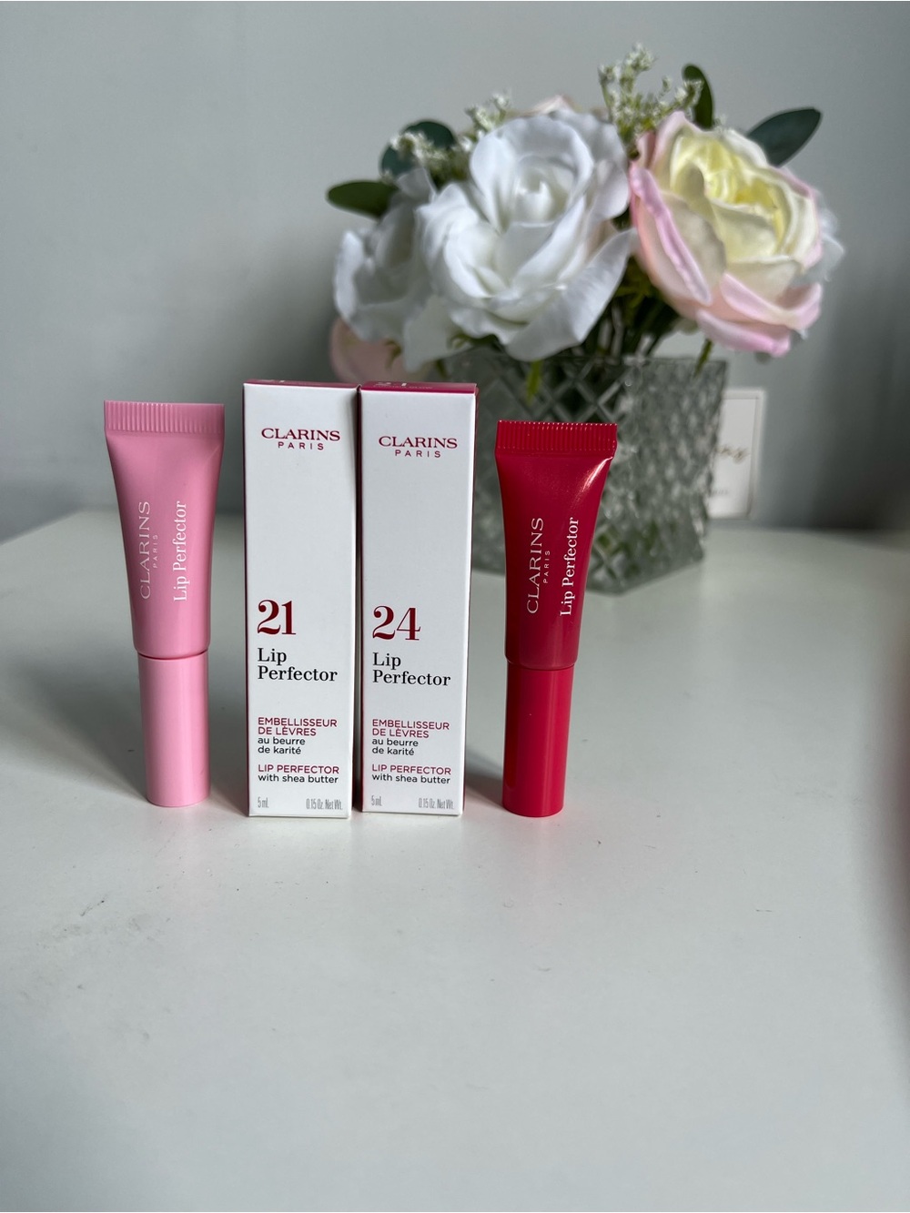 2/18$ Clarins Lip Perfector Balm - (Shade 21 & 24)